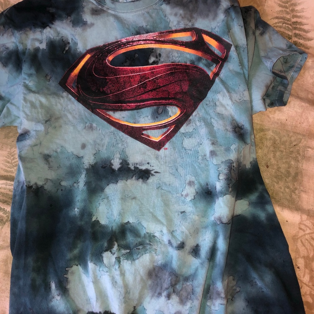 Teal Superman shirt.